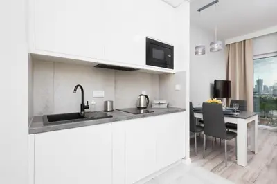 Kuchnia lub aneks kuchenny w obiekcie Apartments with Parking Warsaw Business Center by Noclegi Renters