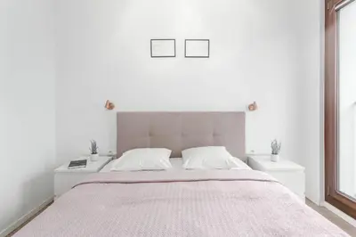 Łóżko lub łóżka w pokoju w obiekcie Chill Apartments Mokotów Residence