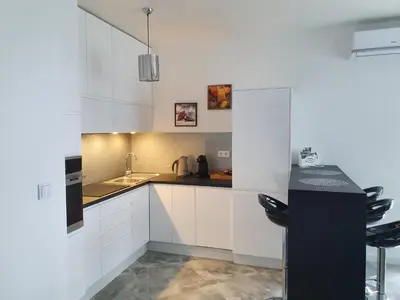 Kuchnia lub aneks kuchenny w obiekcie Apartament na Lazurowej