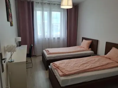 Łóżko lub łóżka w pokoju w obiekcie Apartament na Lazurowej