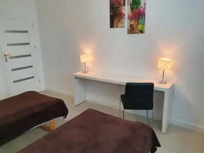 Łóżko lub łóżka w pokoju w obiekcie Apartament na Lazurowej