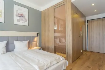 Łóżko lub łóżka w pokoju w obiekcie RentPlanet - Apartamenty Wolska