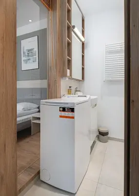 Łóżko lub łóżka w pokoju w obiekcie RentPlanet - Apartamenty Wolska