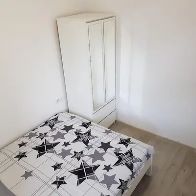 Łóżko lub łóżka w pokoju w obiekcie MirrorRoom PL Downtown
