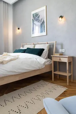 Łóżko lub łóżka w pokoju w obiekcie Warsaw Concierge Filtrowa