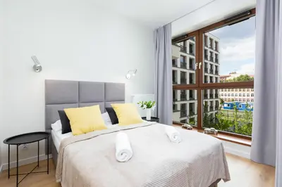 Łóżko lub łóżka w pokoju w obiekcie Apartments Browary Warszawskie by Noclegi Renters