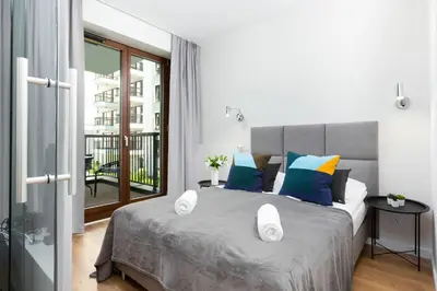 Łóżko lub łóżka w pokoju w obiekcie Apartments Browary Warszawskie by Noclegi Renters