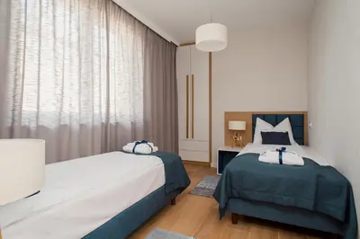 Łóżko lub łóżka w pokoju w obiekcie ShortStayPoland Apartamenty