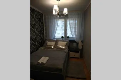 Łóżko lub łóżka w pokoju w obiekcie Silver Pańska 61