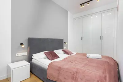 Łóżko lub łóżka w pokoju w obiekcie Sławińska Apartment Warsaw Wola by Noclegi Renters