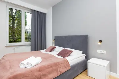Łóżko lub łóżka w pokoju w obiekcie Sławińska Apartment Warsaw Wola by Noclegi Renters