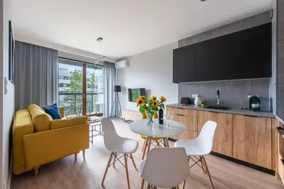 Telewizja i/lub zestaw kina domowego w obiekcie MODUO Serviced Apartments