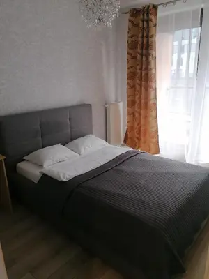 Łóżko lub łóżka w pokoju w obiekcie Apartamenty Warszawskie delux Siedmiogrodzka