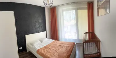 Łóżko lub łóżka w pokoju w obiekcie Apartamenty Warszawskie delux Siedmiogrodzka