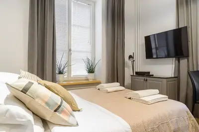 Łóżko lub łóżka w pokoju w obiekcie P&O Serviced Apartments Warecka Street