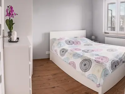 Łóżko lub łóżka w pokoju w obiekcie Marywilska apartment