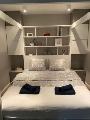 Łóżko lub łóżka w pokoju w obiekcie Błękitny Apartament - Wilanów