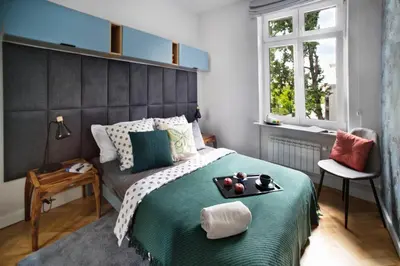 Łóżko lub łóżka w pokoju w obiekcie Siewierska P&O Serviced Apartments