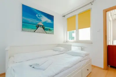 Łóżko lub łóżka w pokoju w obiekcie ShortStayPoland Św. Wincentego (B7)