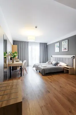 Łóżko lub łóżka w pokoju w obiekcie Wolska Residence