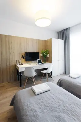 Łóżko lub łóżka w pokoju w obiekcie Wolska Residence