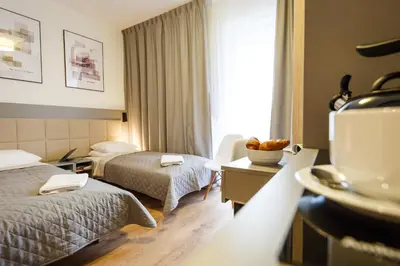 Łóżko lub łóżka w pokoju w obiekcie Wolska Residence