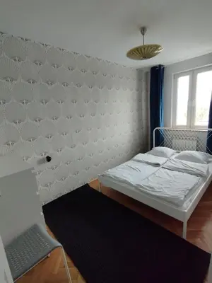 Łóżko lub łóżka w pokoju w obiekcie Warszawa Apartament z Widokiem