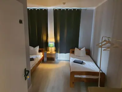 Łóżko lub łóżka w pokoju w obiekcie Jasna Hotelik self check-in