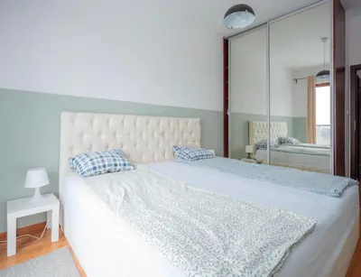 Łóżko lub łóżka w pokoju w obiekcie FIRST -- Green Żoliborz apartment 3