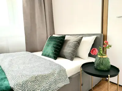 Łóżko lub łóżka w pokoju w obiekcie Rental Apartments Smolna