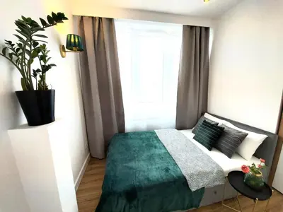 Łóżko lub łóżka w pokoju w obiekcie Rental Apartments Smolna