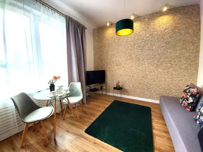 Telewizja i/lub zestaw kina domowego w obiekcie Rental Apartments Smolna
