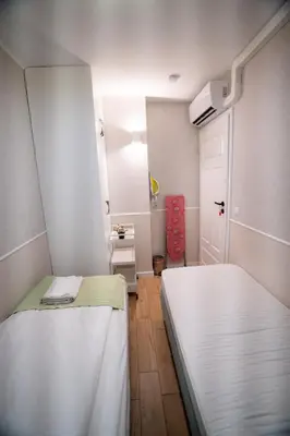 Łóżko lub łóżka w pokoju w obiekcie Apartament Hotel Chłodna 15