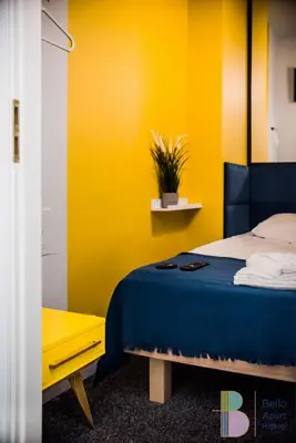 Łóżko lub łóżka w pokoju w obiekcie Bello ApartHostel Private Rooms