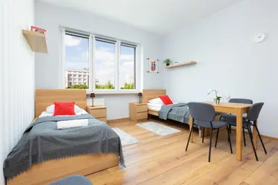 Łóżko lub łóżka w pokoju w obiekcie Apartment Warsaw Puławska by Noclegi Renters