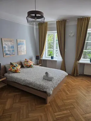 Łóżko lub łóżka w pokoju w obiekcie Freta 11 Old Town