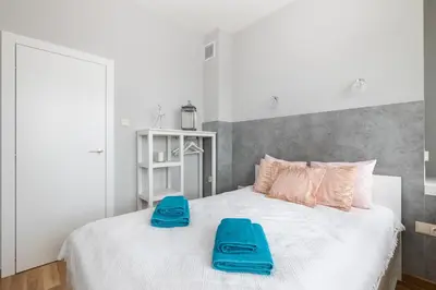 Łóżko lub łóżka w pokoju w obiekcie Apartament Świętokrzyska by Your Freedom