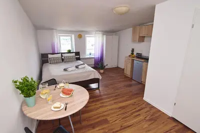 Łóżko lub łóżka w pokoju w obiekcie Regem Apartments Waryńskiego
