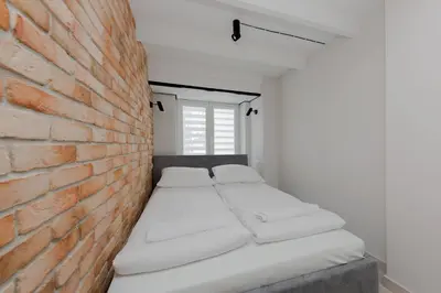 Łóżko lub łóżka w pokoju w obiekcie 4 ECO Apart Chateau Jagiellonska 22 Warszawa Old Town
