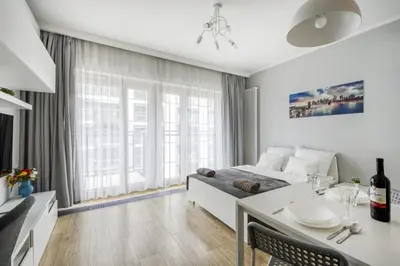 Telewizja i/lub zestaw kina domowego w obiekcie Warsaw Night Apartments Mennica Residence