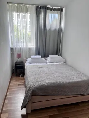 Łóżko lub łóżka w pokoju w obiekcie OhMyHome - Park Mirowski Apartment