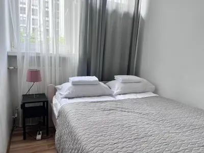 Łóżko lub łóżka w pokoju w obiekcie OhMyHome - Park Mirowski Apartment