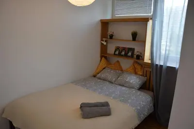 Łóżko lub łóżka w pokoju w obiekcie OhMyHome - Sunny Apartment in City Center