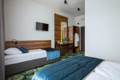 Łóżko lub łóżka w pokoju w obiekcie Bloom Hotel Airport Okęcie