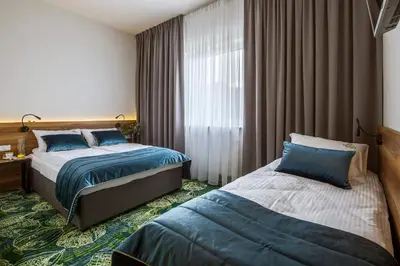 Łóżko lub łóżka w pokoju w obiekcie Bloom Hotel Airport Okęcie
