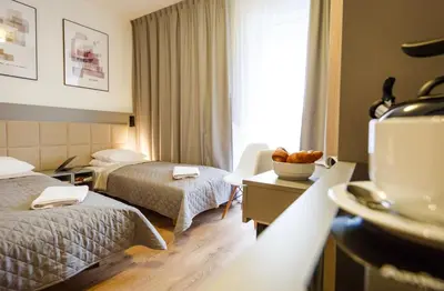Łóżko lub łóżka w pokoju w obiekcie Wolska Residence I