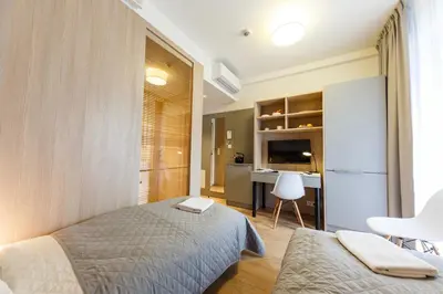 Łóżko lub łóżka w pokoju w obiekcie Wolska Residence I