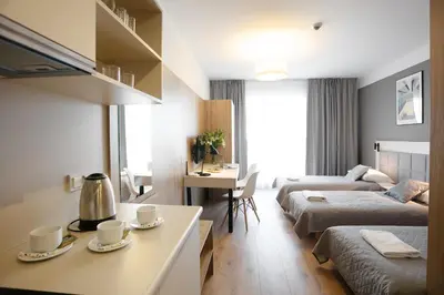 Łóżko lub łóżka w pokoju w obiekcie Wolska Residence I