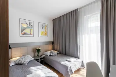 Łóżko lub łóżka w pokoju w obiekcie Wolska Residence I