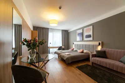 Łóżko lub łóżka w pokoju w obiekcie Wolska Residence I